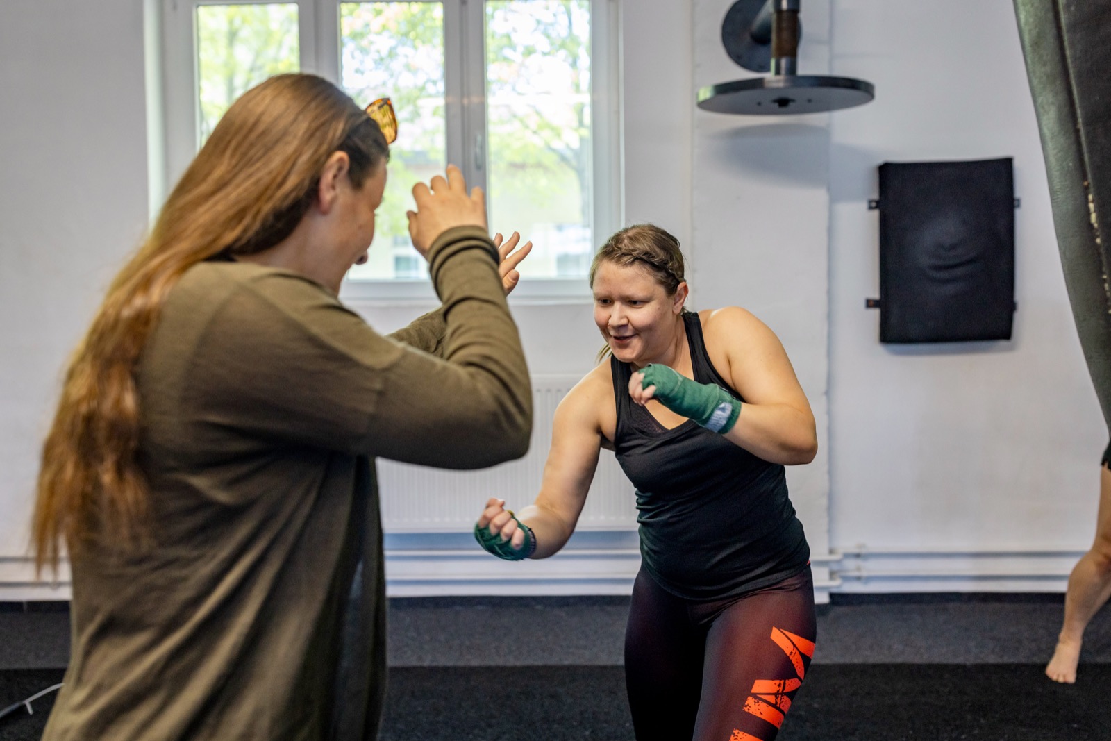 Women in striking training and sparring at HERA event